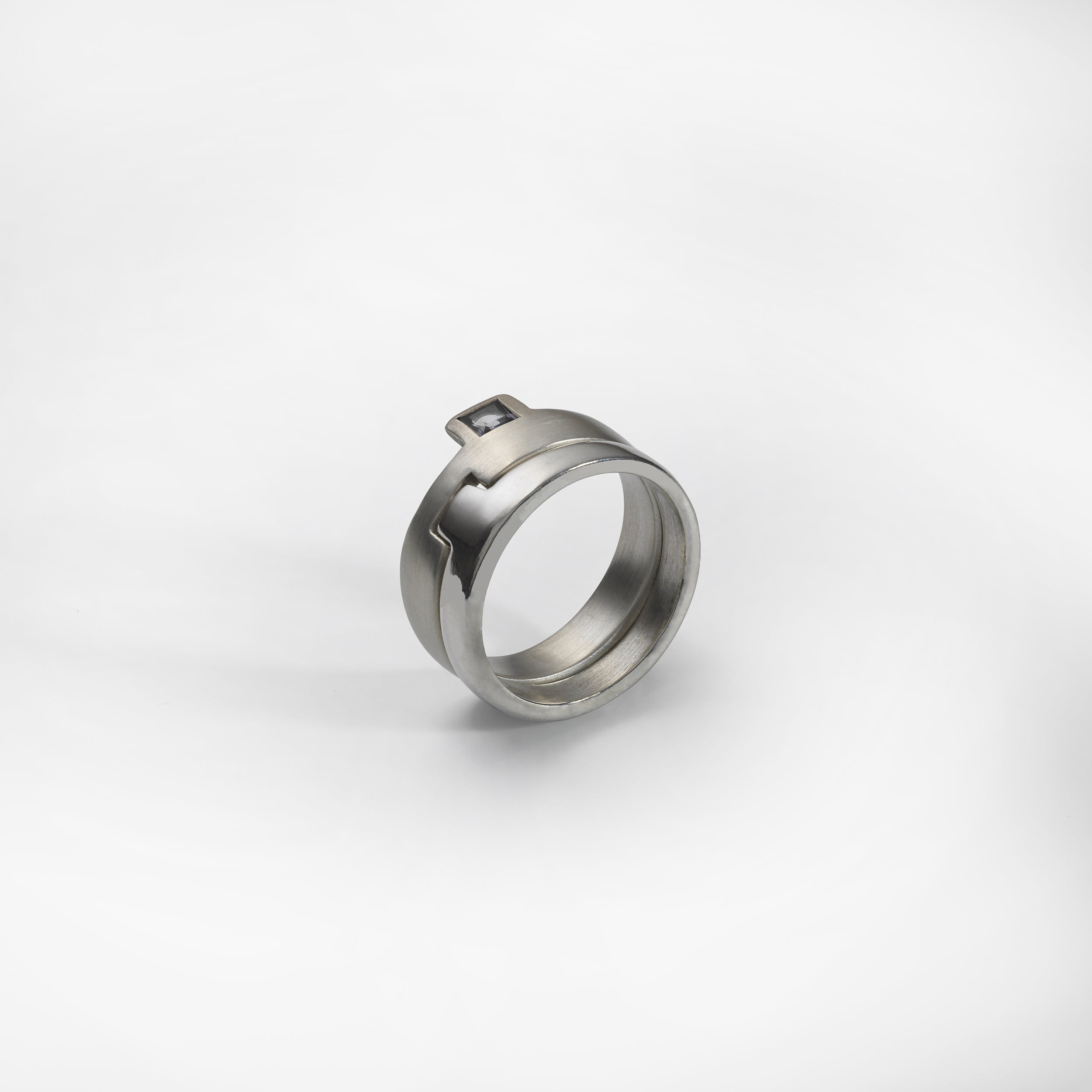 Puzzle ring, sterling silver, set with a red garnet