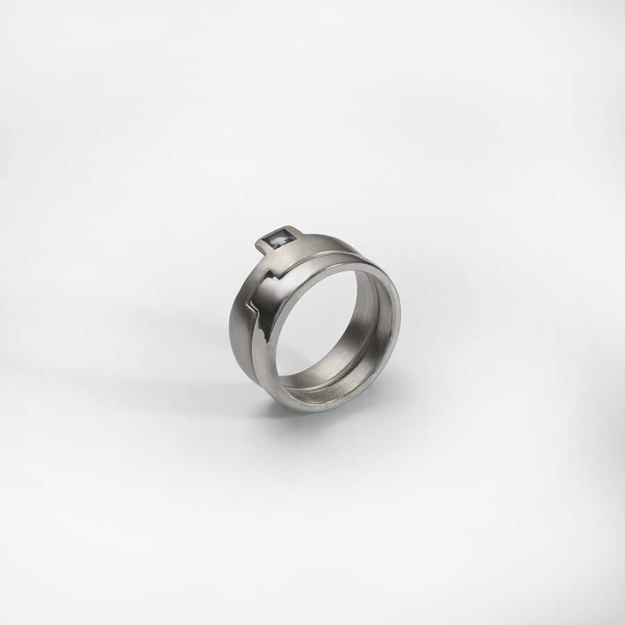 Puzzle ring, sterling silver, set with a red garnet