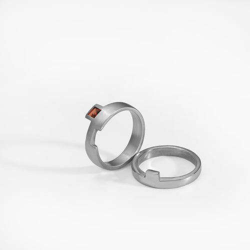 Puzzle ring, sterling silver, set with a red garnet