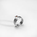 Bague Puzzle, argent, sertie d'un grenat rouge